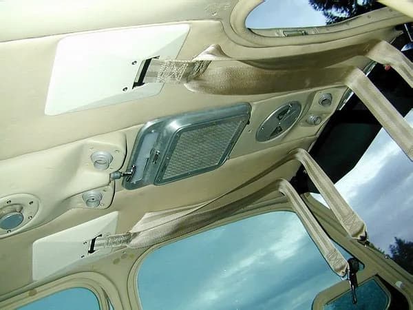 Plastic dress fairing for headliner