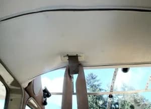Plastic dress fairing for headliner