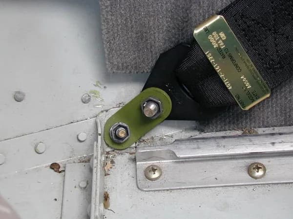 Outboard lap belt attachment
